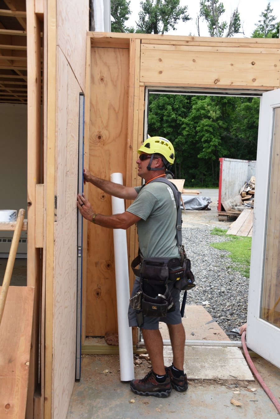 Jimmy Costa works on a wall.