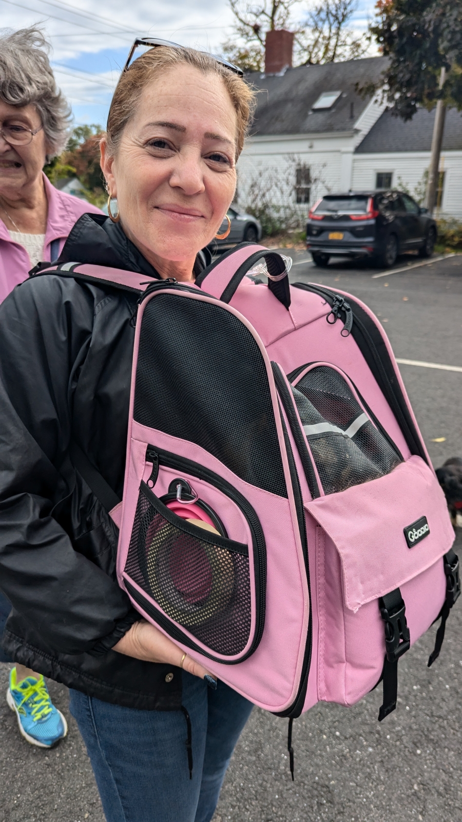 Woman with cat in a carrier