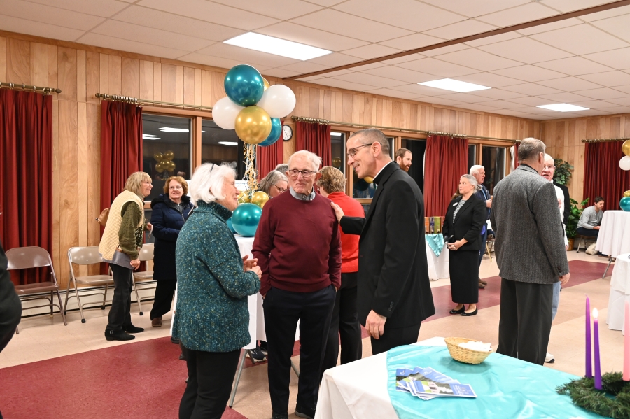 Bishop speaking to couple