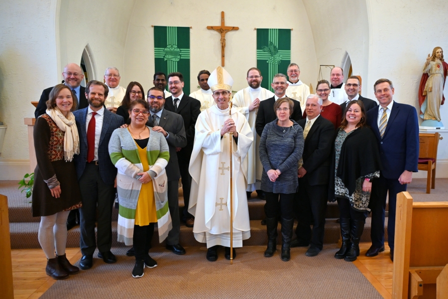Deacon candidates and their wives with Bishop Ruggieri, priests from St. Michael Parish, Deacon Peter Bernier, and Peter Czerwinski.
