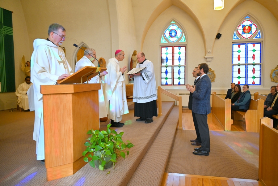 Deacon Candidates Stephen Ritchie and Richard Roussel stand before Bishop Ruggieri.