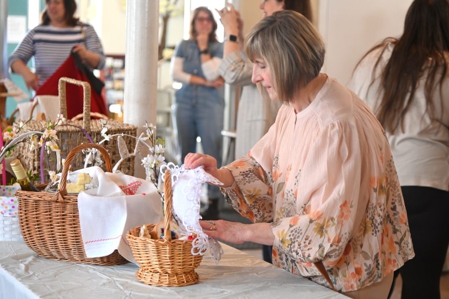 Woman putting down and Easter basket.