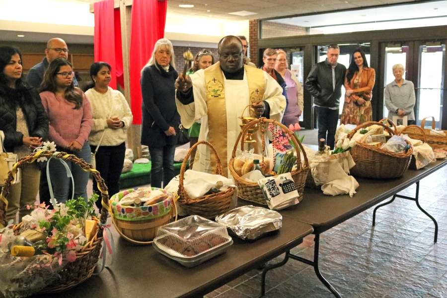 Father Kilian blesses Easter baskets