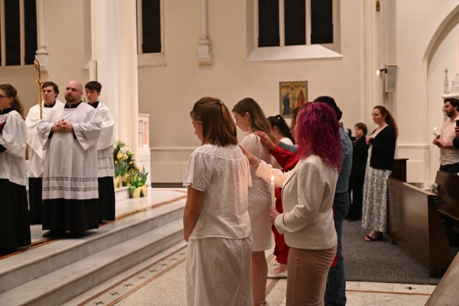 Those being confirmed stand before the bishop