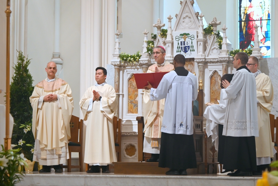 Opening collect is read by Bishop James Ruggieri. Also pictured is Father Seamus Griesbach, Deacon Thanh Duc Pham and altar servers