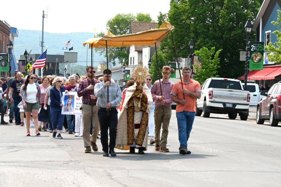Father Antony Alexander Maria Doss carrying the monstrance