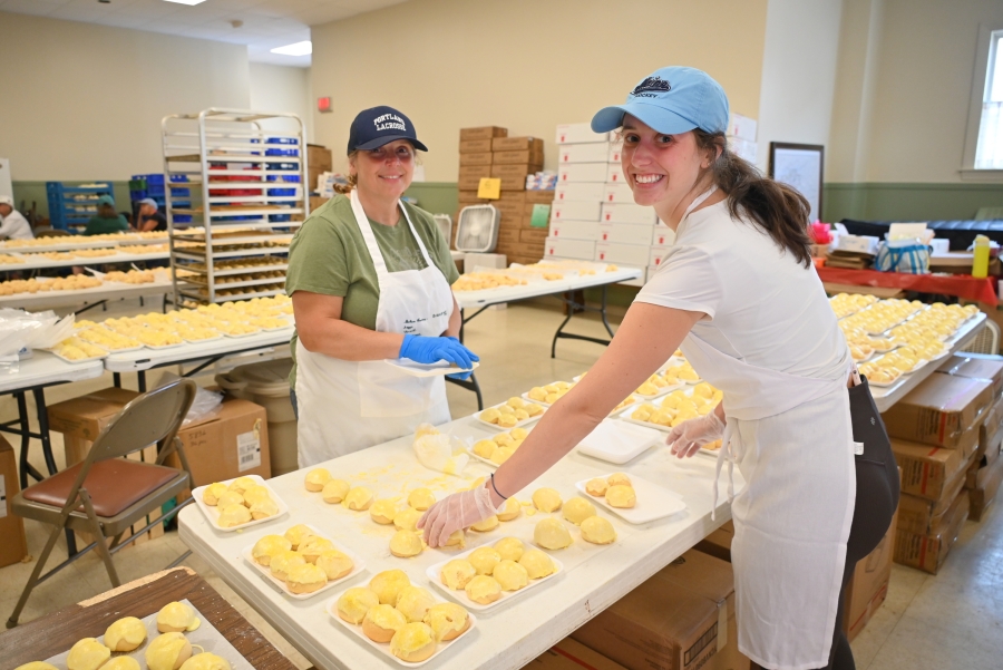 Two women making cookies.