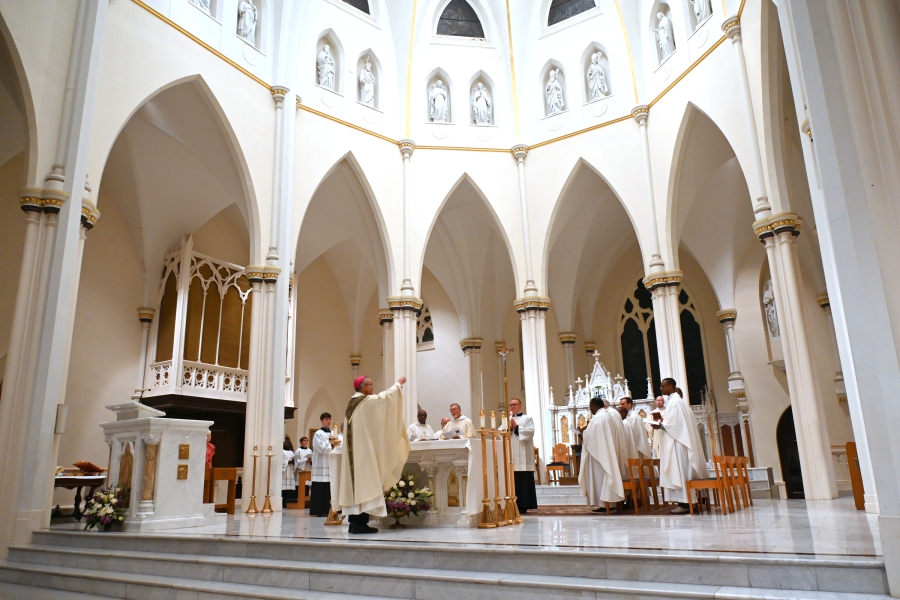 Bishop James Ruggieri incenses the altar.