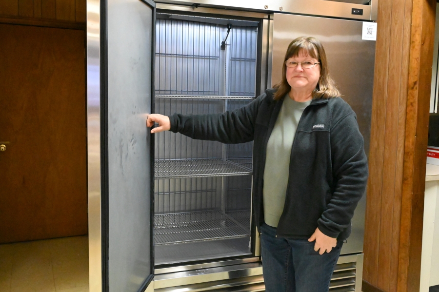 Janet Lepage in front of the new freezer