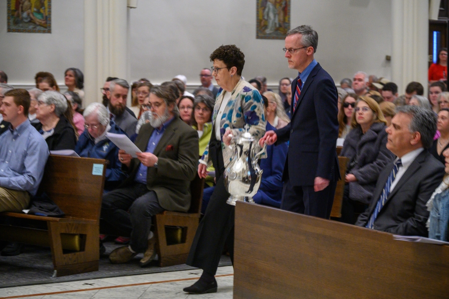 parishioners present oils