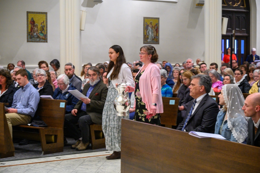 parishioners present oils