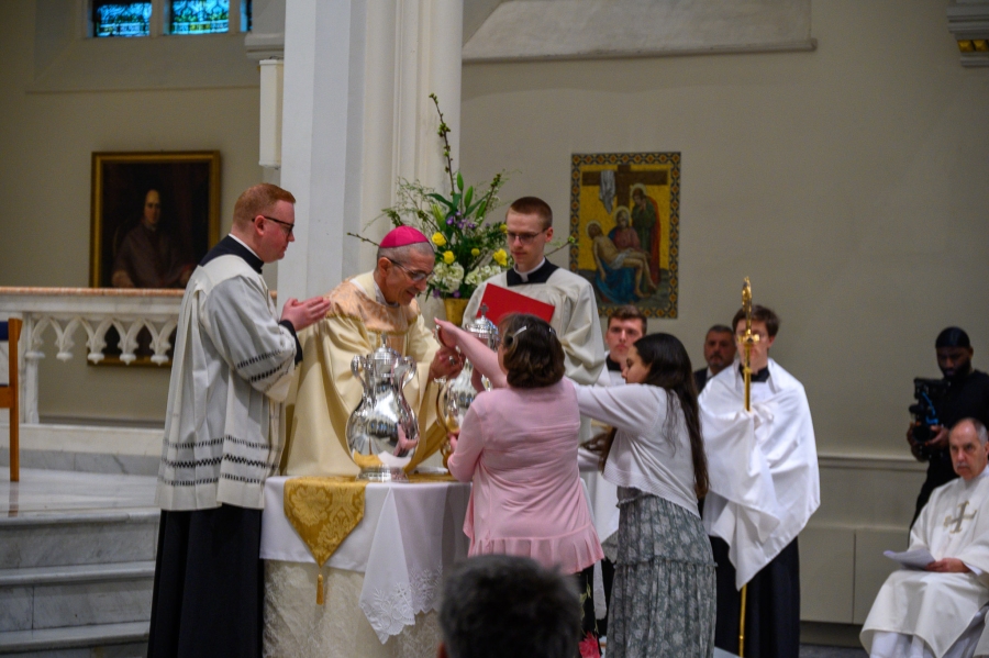 parishioners present oils