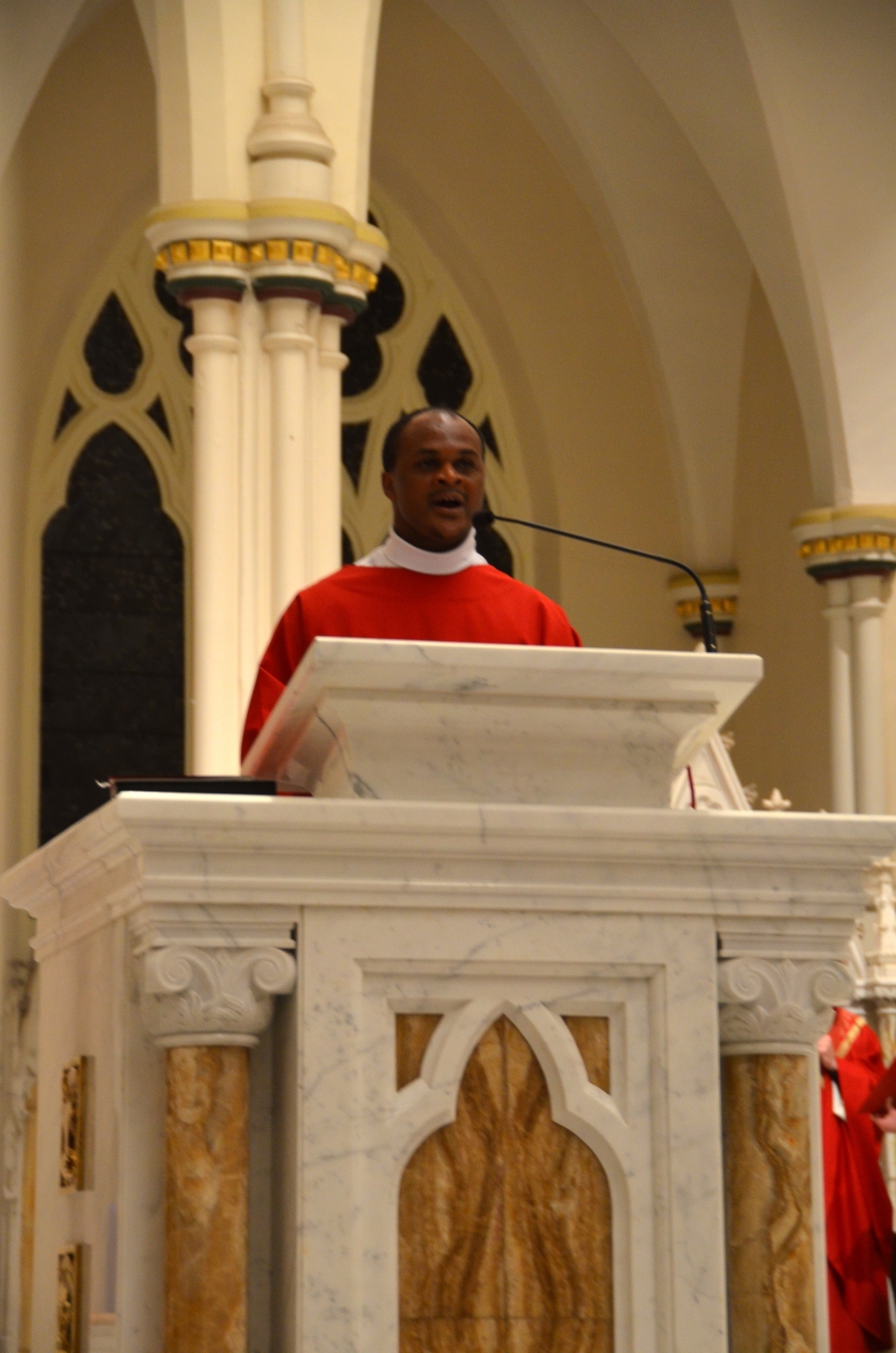 Deacon singing at the ambo