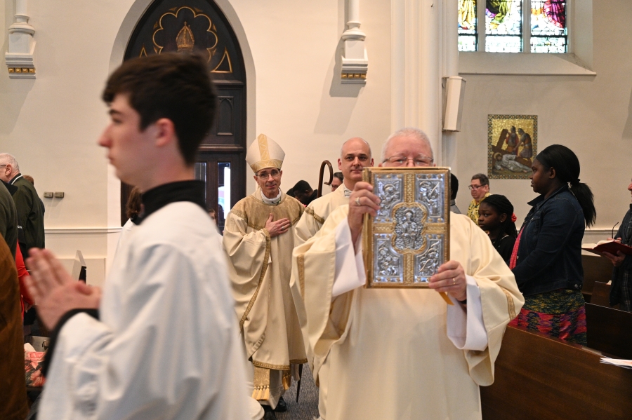 Deacon carrying the Gospel book