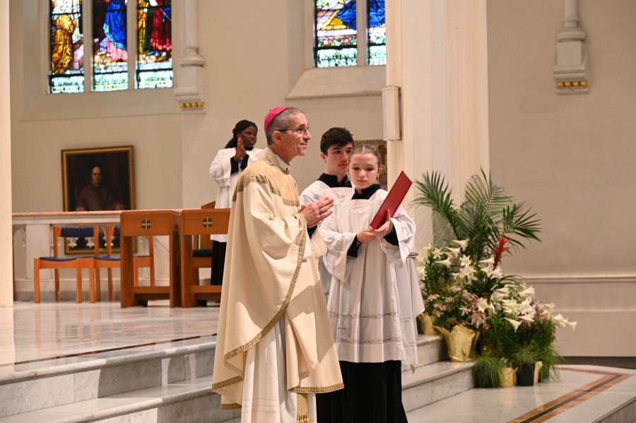 Bishop on the altar with servers