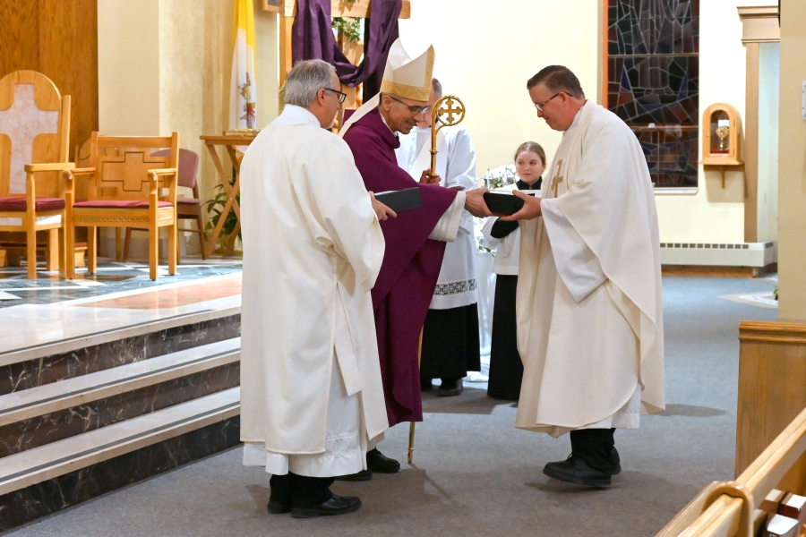 Father Kevin Martin receives the sacred oils