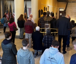 People kneeling and praying the Rosary at the State House