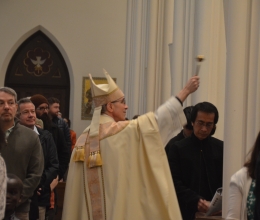 Bishop blesses congregation with holy water