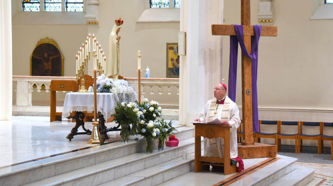 Bishop Robert Deeley prays the Prayer of Consecration