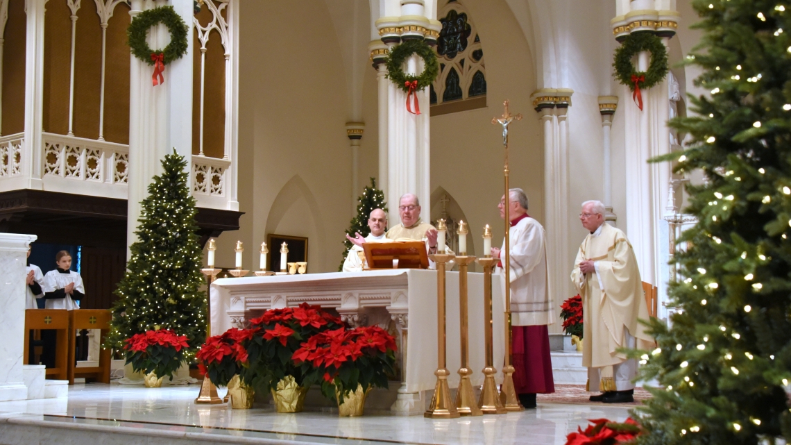 Bishop Deeley celebrates the Eucharist with Msgr. Fay and Fr. Griesbach