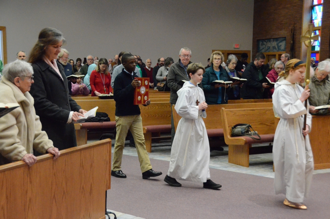 students process at Mass