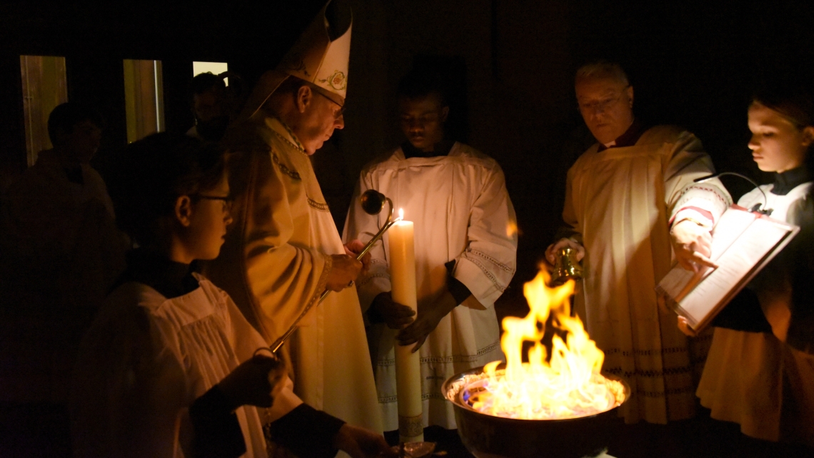 Bishop Deeley lights the Paschal Candle.