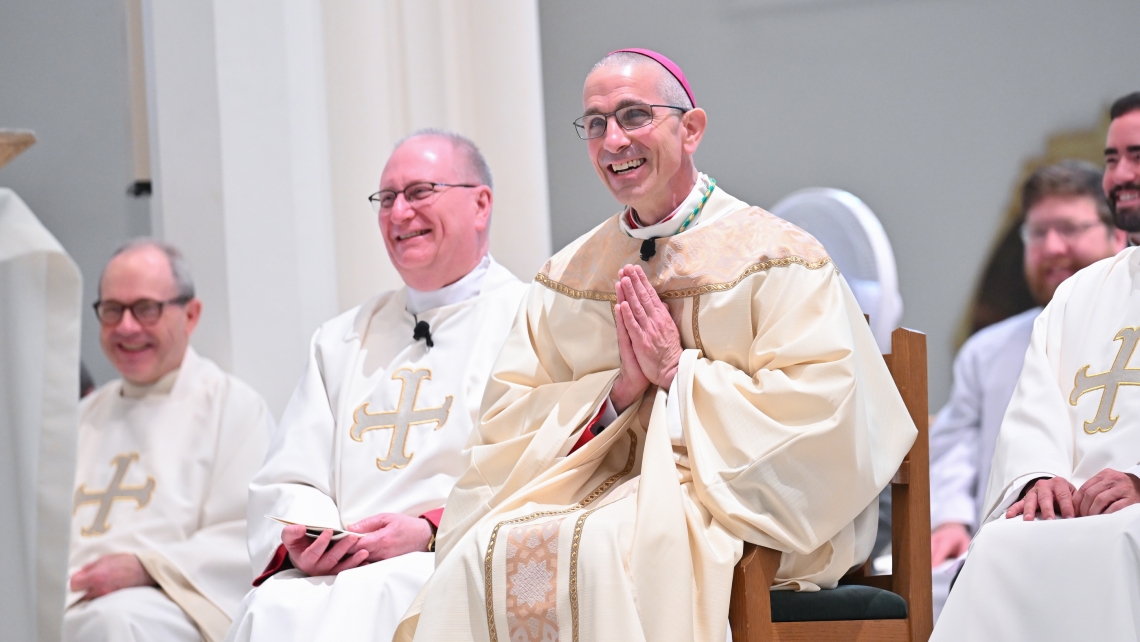 Bishop Ruggieri and Msgr. Dubois laughing during Bishop Ruggieri's ordination Mass.