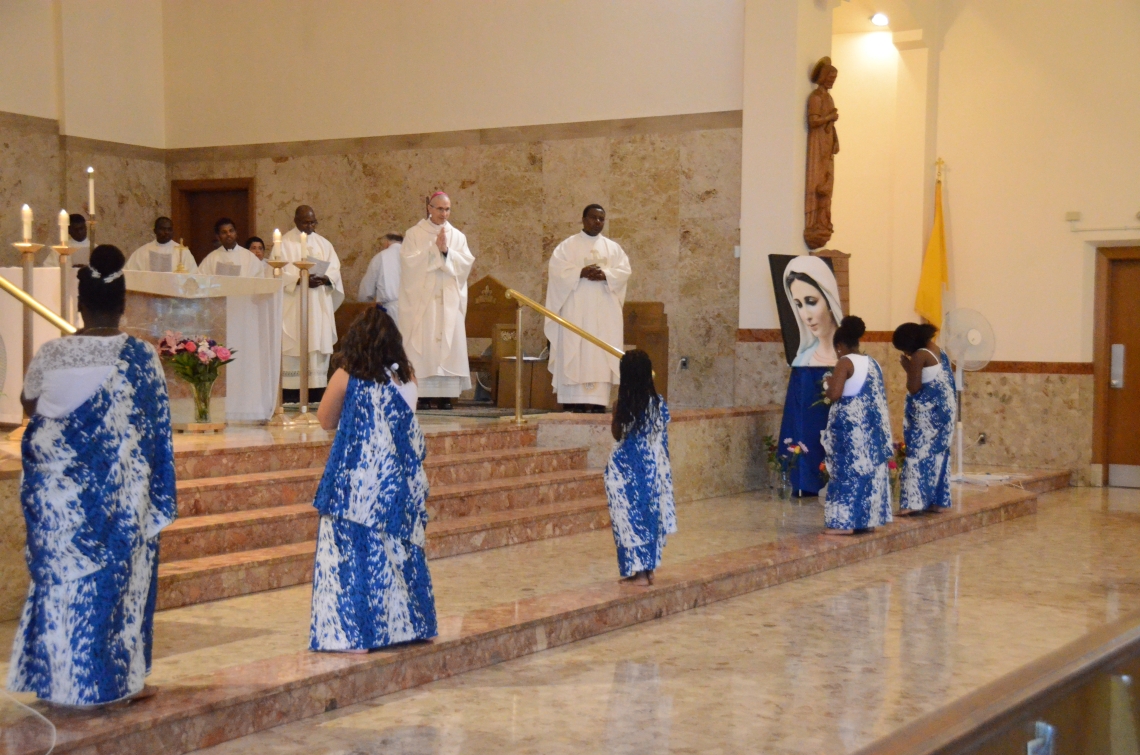 Children dancing at the altar