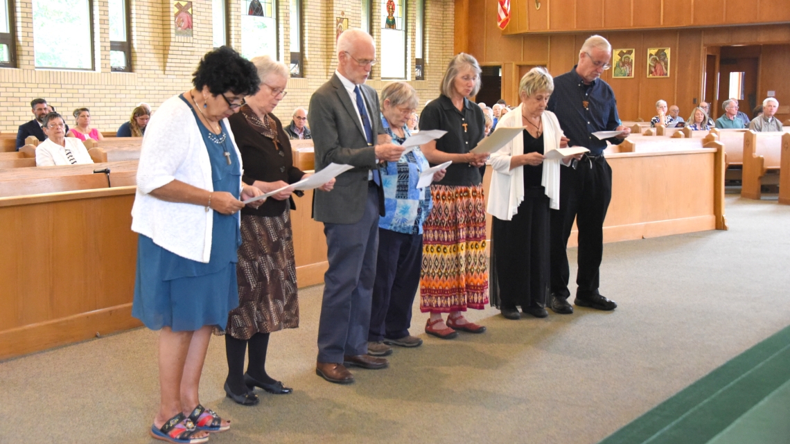 Members of the St. John the Baptist Fraternity renew their promises.