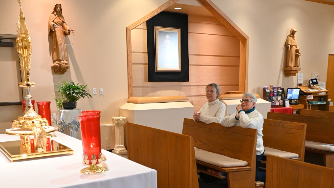 Doris Belanger and Regina Scanlon in the River Adoration Chapel in Lewiston.