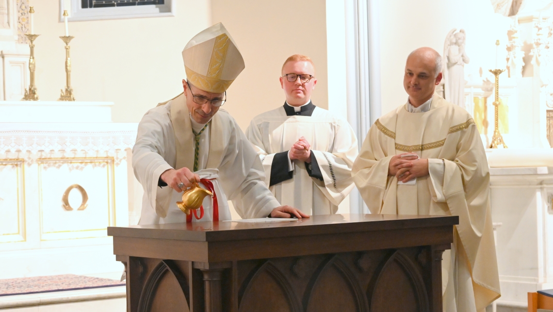Bishop Ruggieri anoints the altar with sacred chrism.
