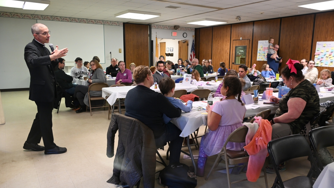 Bishop James Ruggieri takes part in a question and answer period.