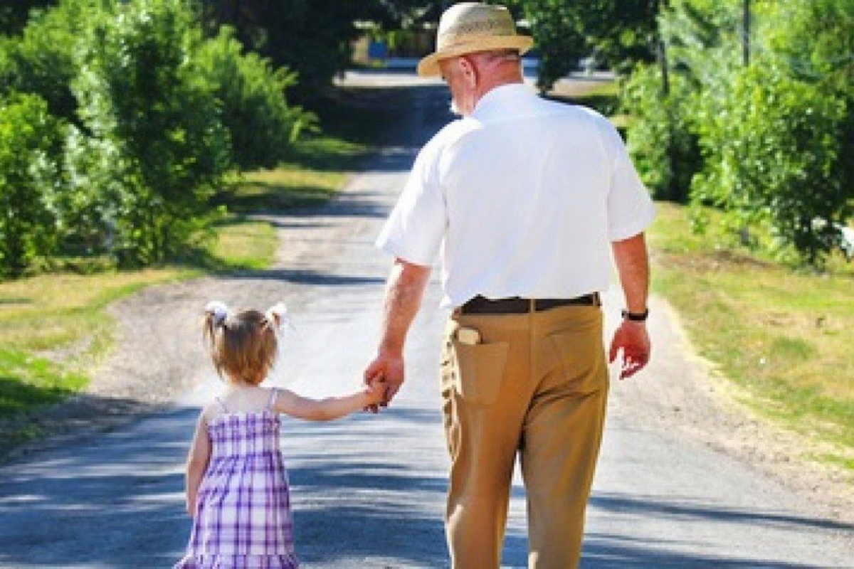 grandfather and child walking