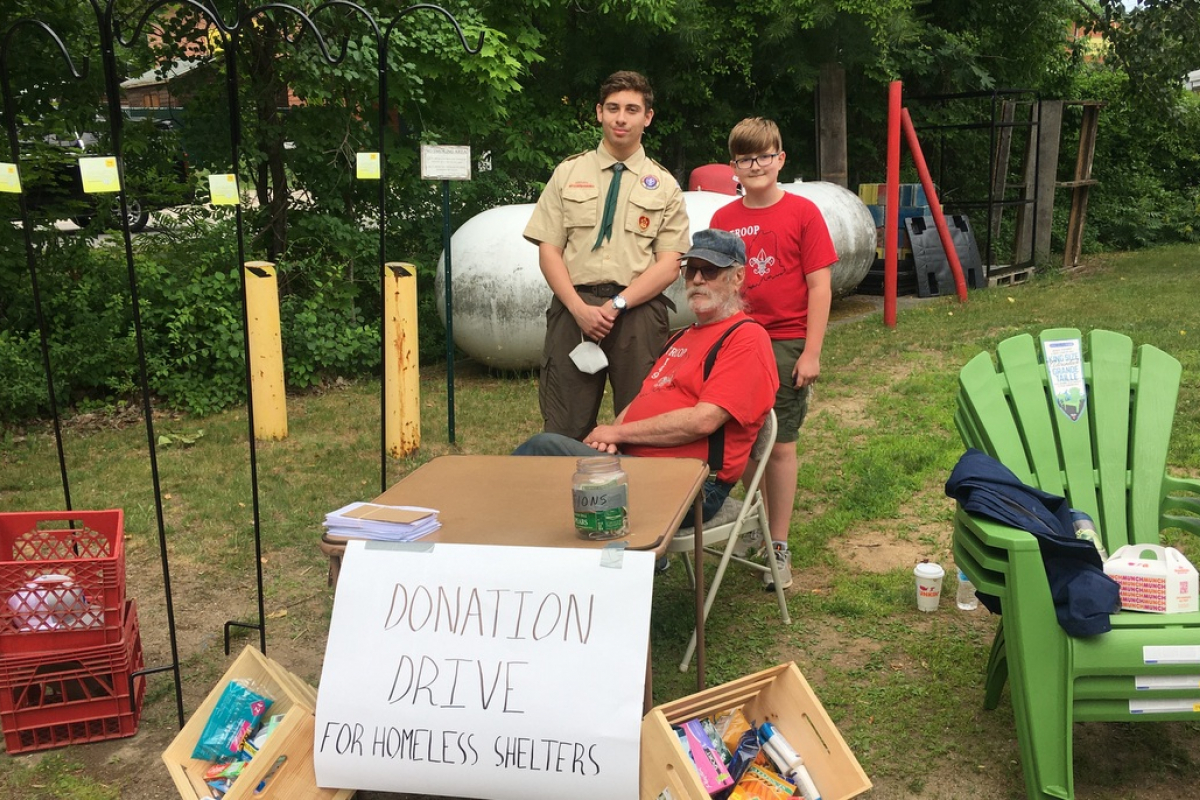 Joe Angelo collecting items.