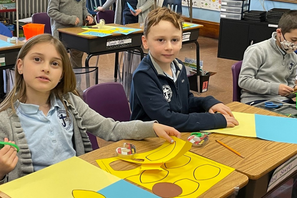 St. James students cut out sunflower petals.