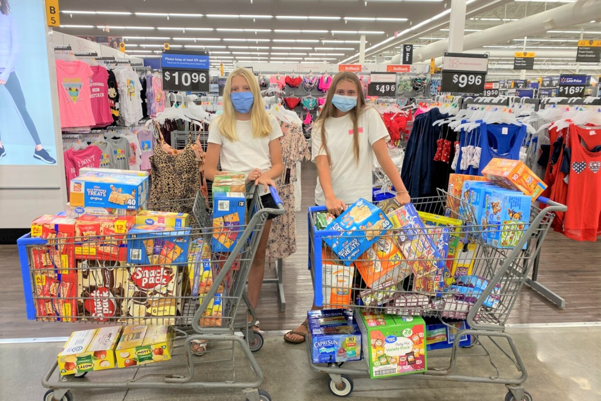 shoppers with carts of food