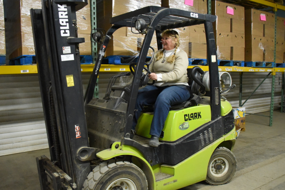 Dixie Shaw on a forklift