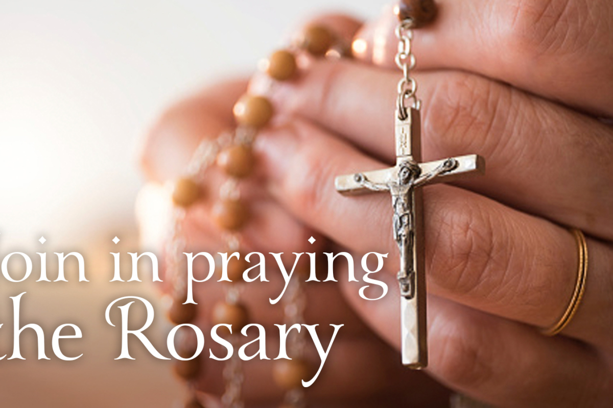 Hands with rosary beads