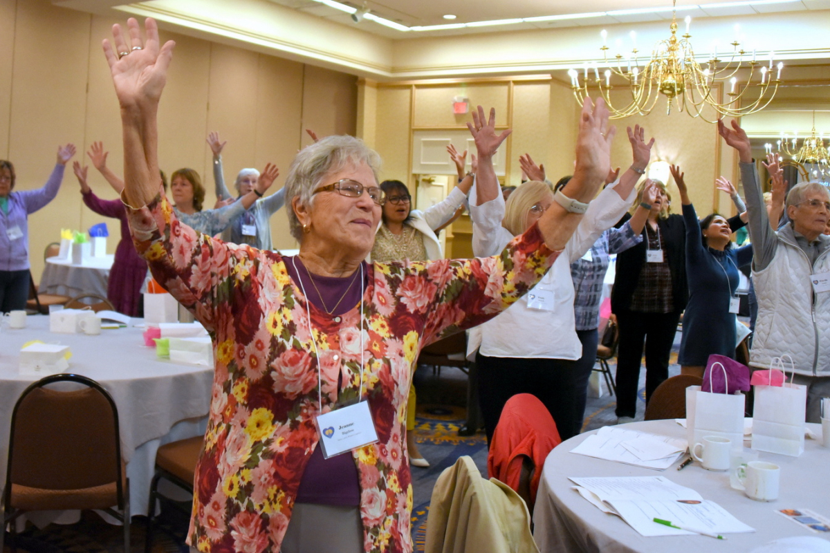 Women with raised hands