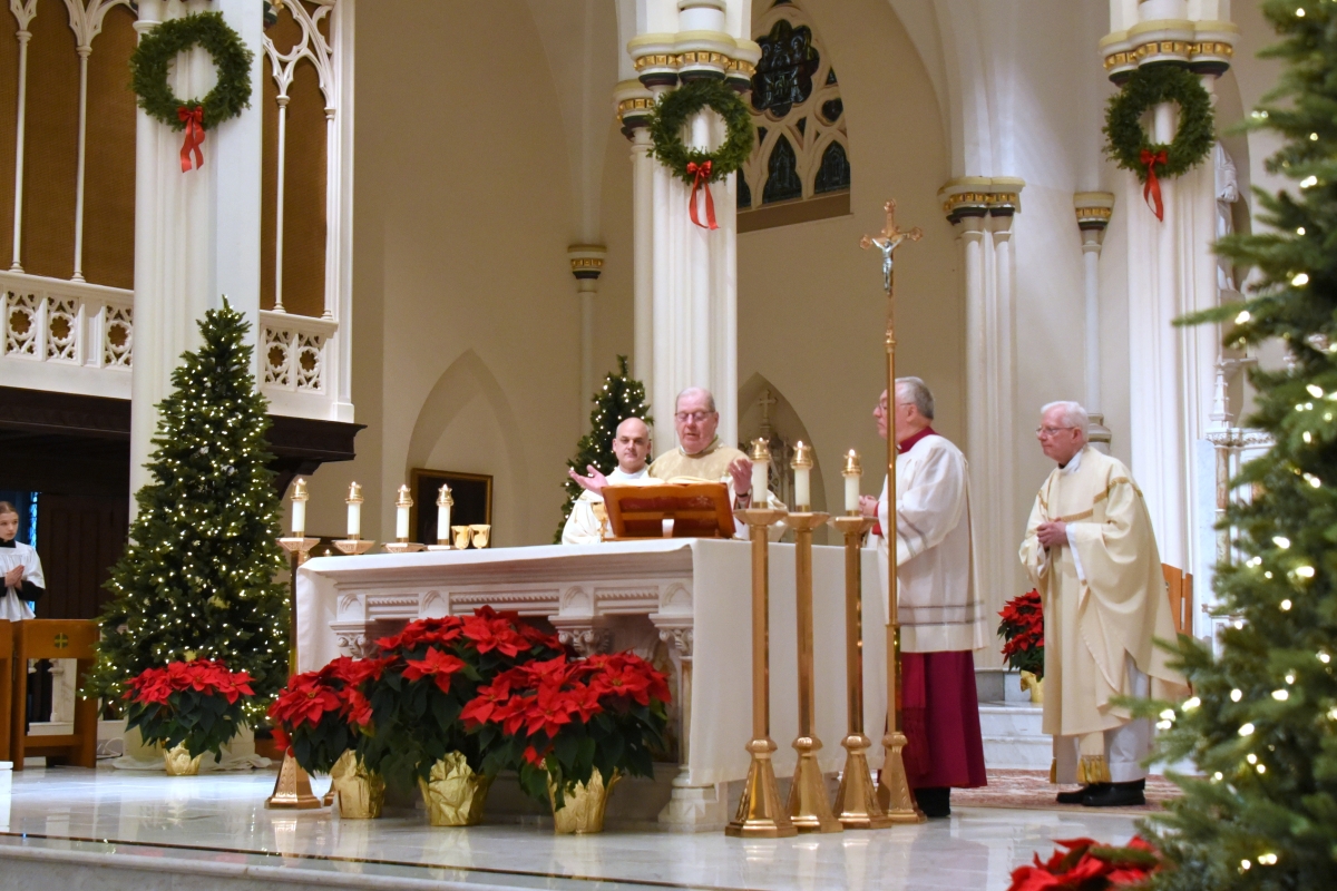 Bishop Deeley celebrates the Eucharist with Msgr. Fay and Fr. Griesbach