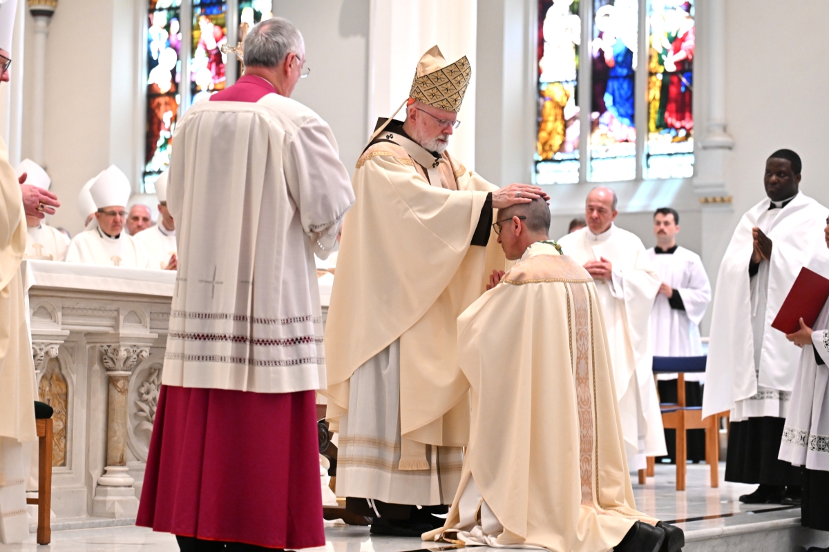 Cardinal Sean O'Malley lays hands on Bishop James Ruggieri.