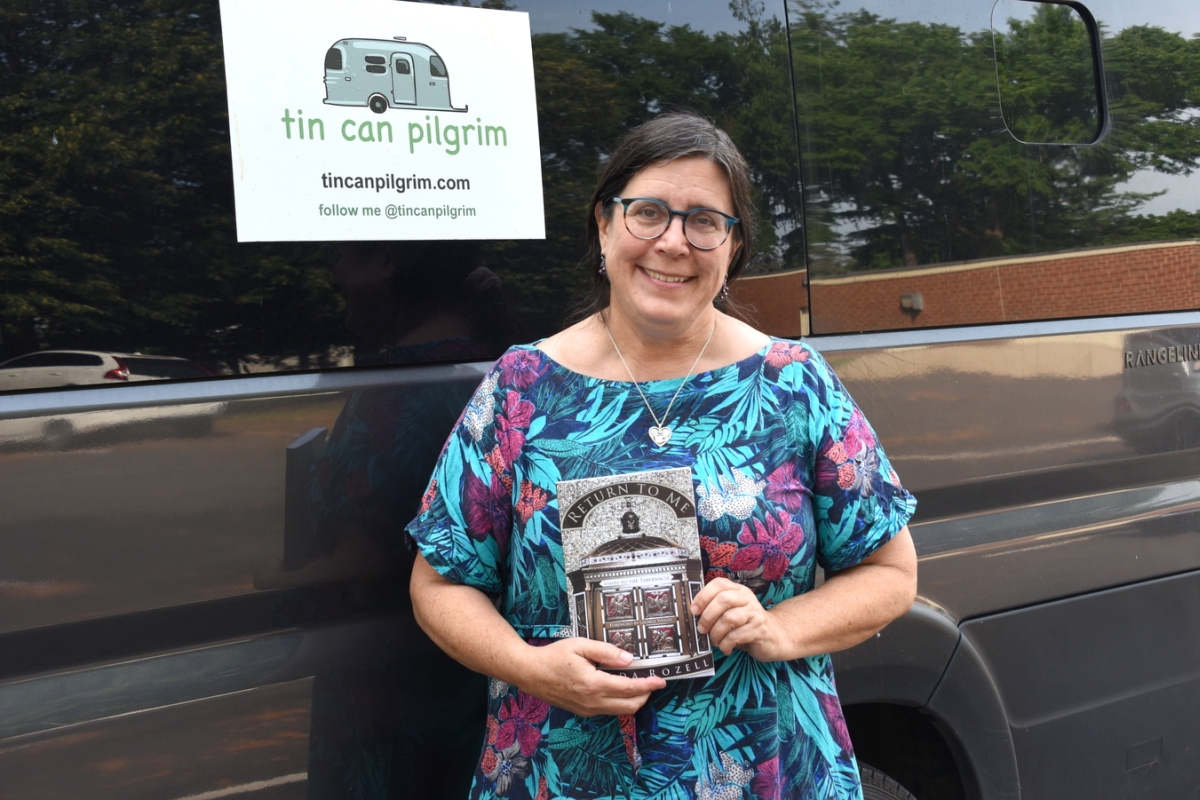 Lynda Rozell in front of her van